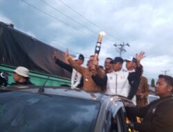 Kirab Api PON XXI Sumut-Aceh Diarak Keliling Balige Kabupaten Toba